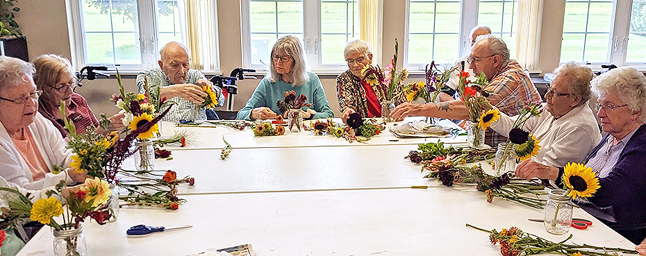 Morningside folks make bouquets of summer flowers.